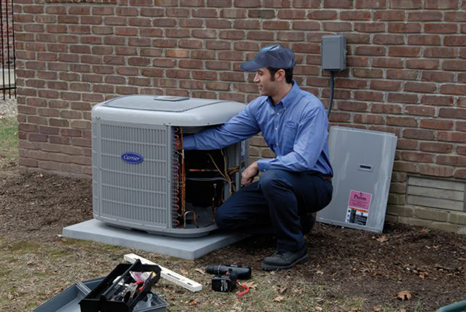 Our AC Repair technician servicing a customer's house in Columbus OH